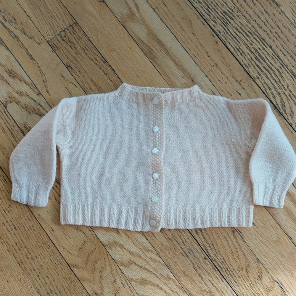 Vintage 1950s hand-knit sweater for baby.